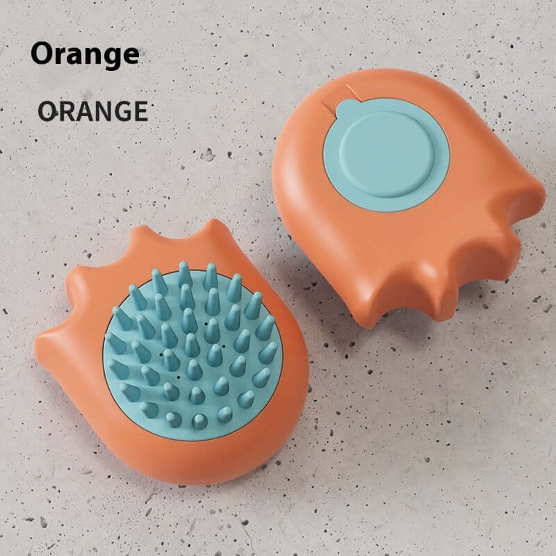 Orange pet bath brush for cats and dogs, featuring a paw-shaped design and massage bristles, made from durable ABS material.