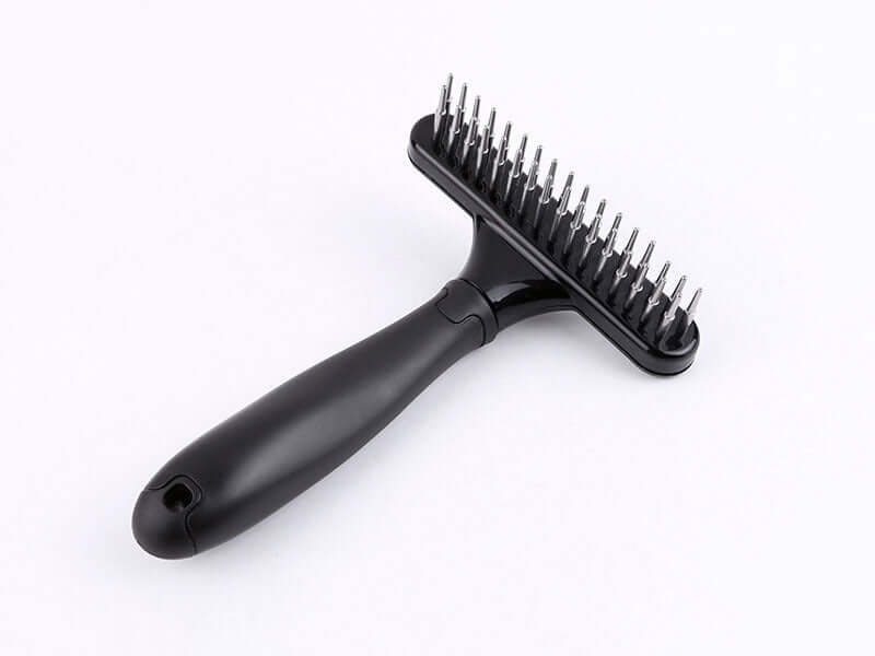 Pet hair removal brush with stainless steel bristles for effective grooming and knot removal in pets, features ergonomic black handle.